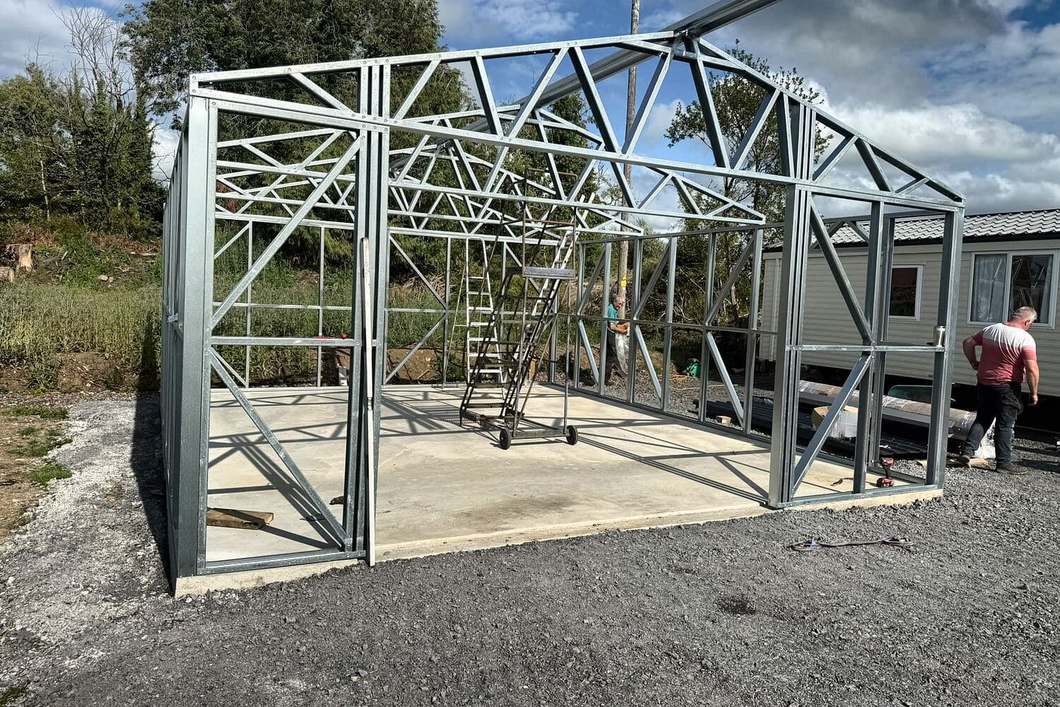 Steel shed frame standing on a concrete base